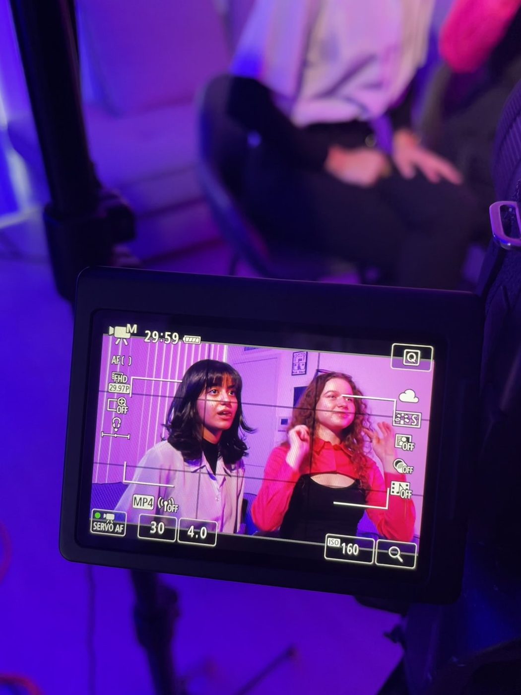 Deniz and Maria on the camera monitor during their interview after the shoot