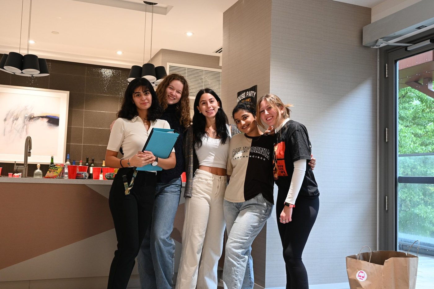 The women of the crew posing in the kitchen