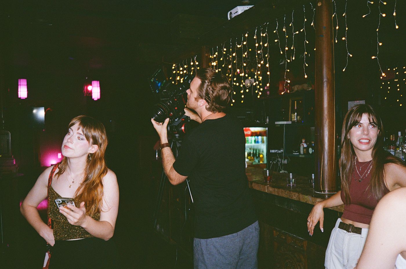Camera operator shooting in a bar