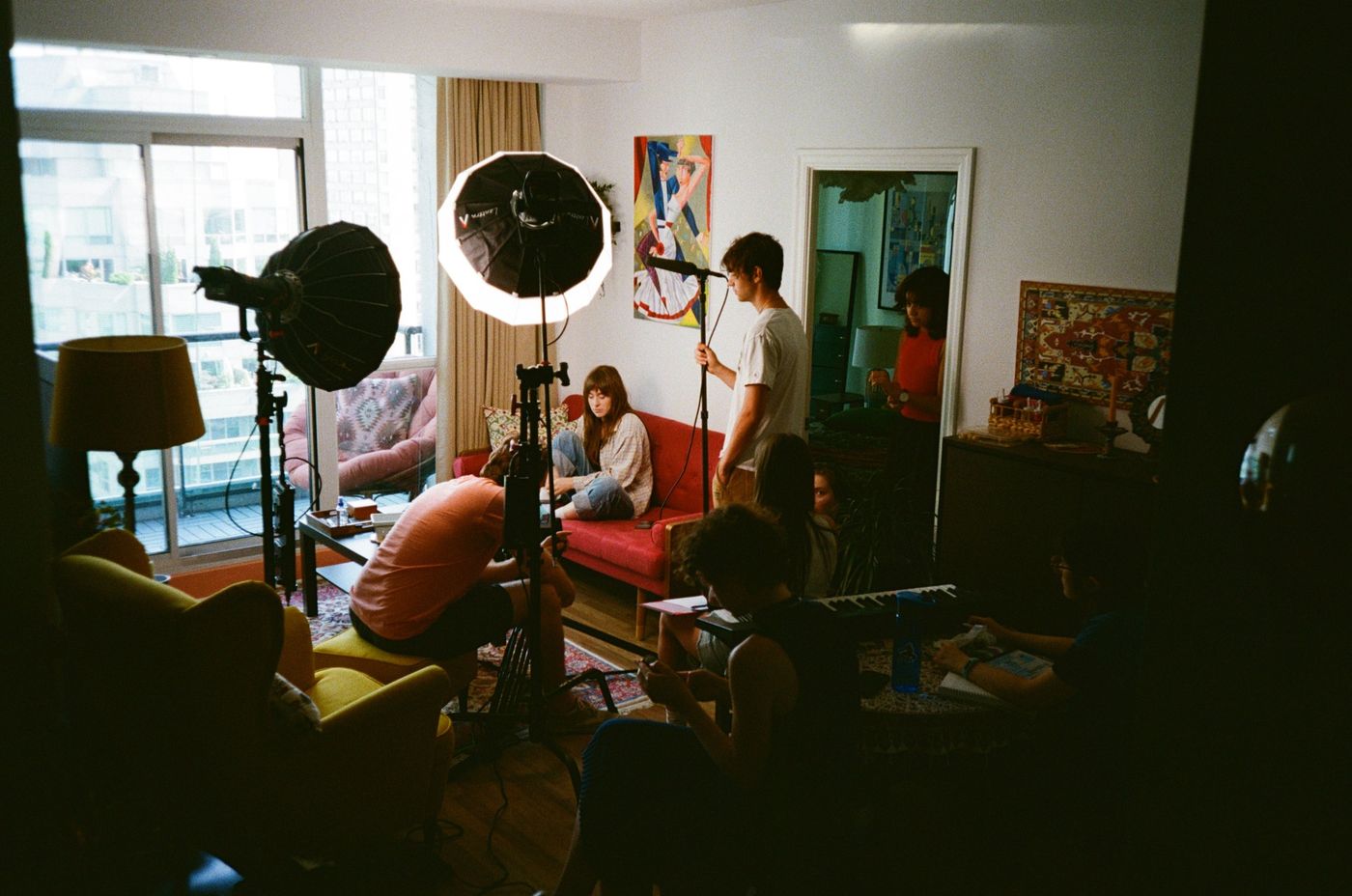 Crew filming on the red couch